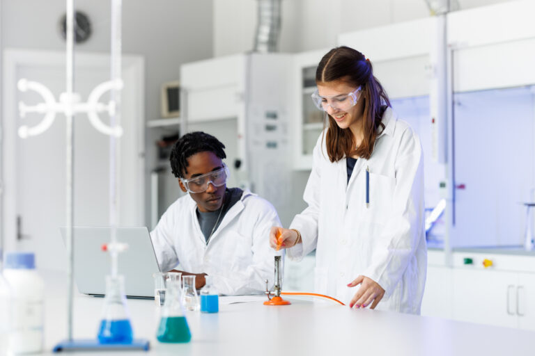 Two students conducting a science experiment in the school lab.